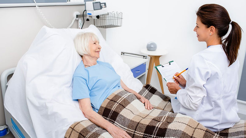 patient lying on the bed and doctor examining the patient