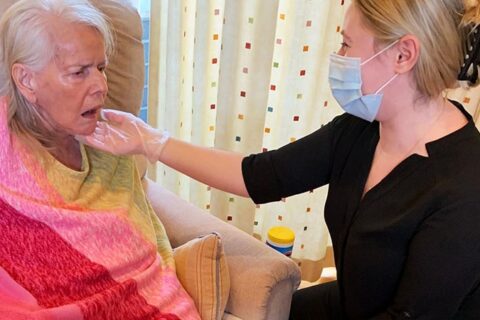 Woman taking care of senior woman and senior lady sitting on the chair