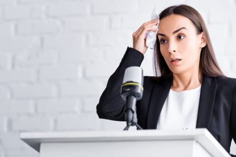 Woman sweating in front of the mic