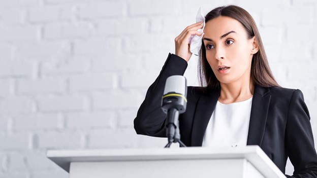 Woman sweating in front of the mic