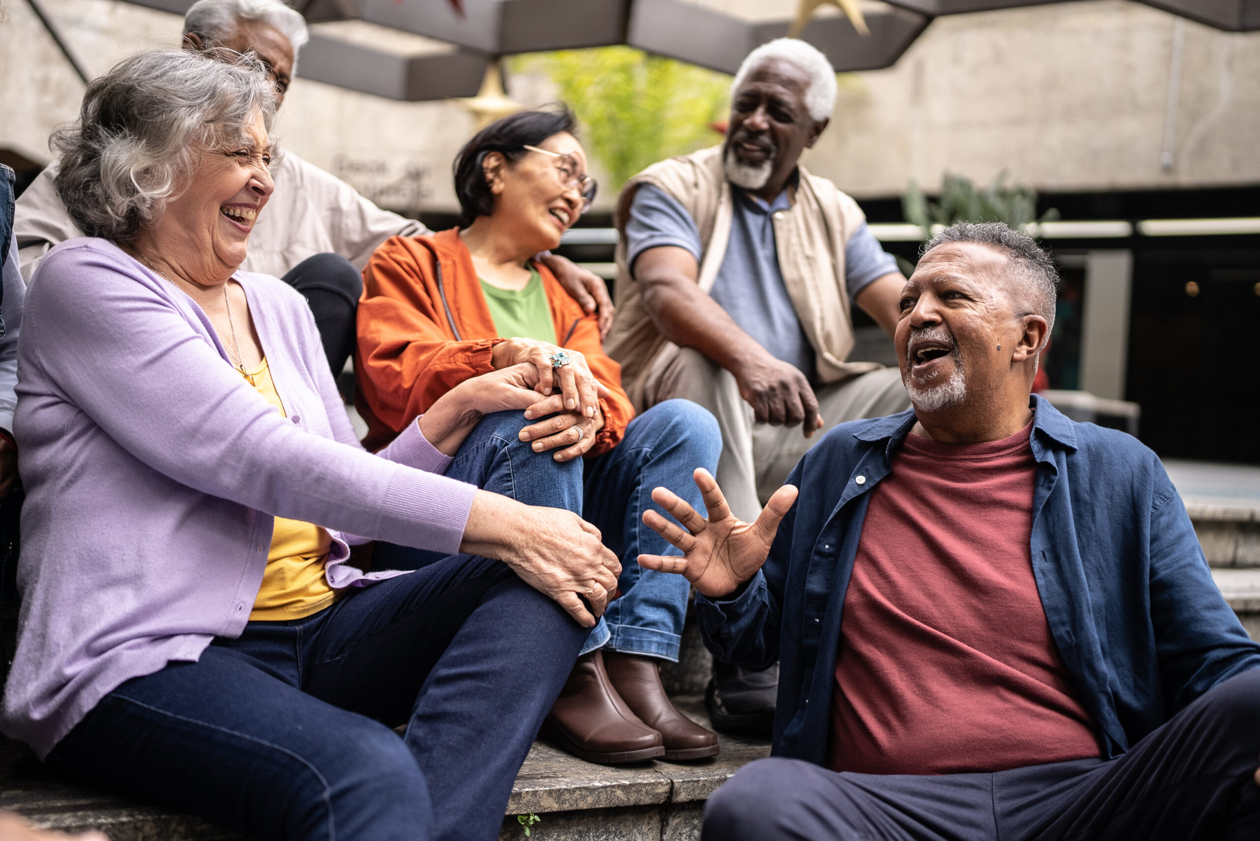 A group of older adults enjoying a friendly conversation.